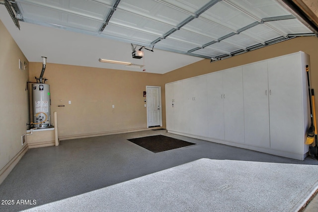 garage with water heater and a garage door opener