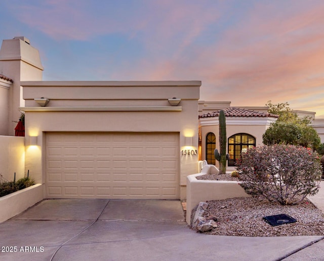 view of front of home with a garage