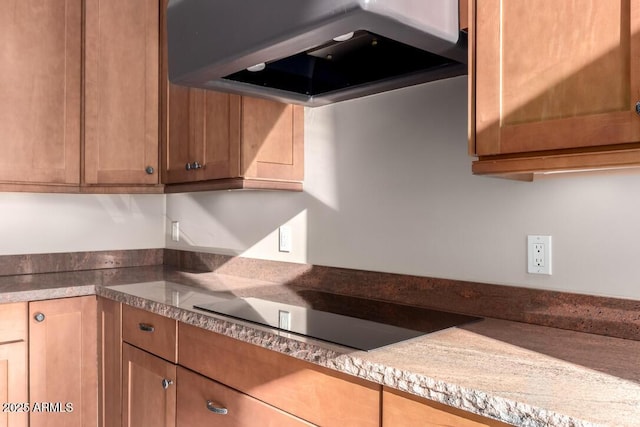 kitchen featuring extractor fan and black electric stovetop