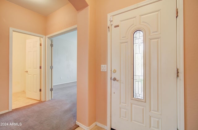 5659 S 239th Dr, Buckeye, AZ 85326 - entrance foyer featuring arched walkways, carpet, and baseboards