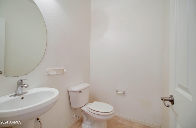 5659 S 239th Dr, Buckeye, AZ 85326 - bathroom with baseboards, a sink, and toilet