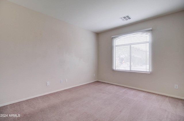 5659 S 239th Dr, Buckeye, AZ 85326 - unfurnished room featuring light carpet, baseboards, and visible vents