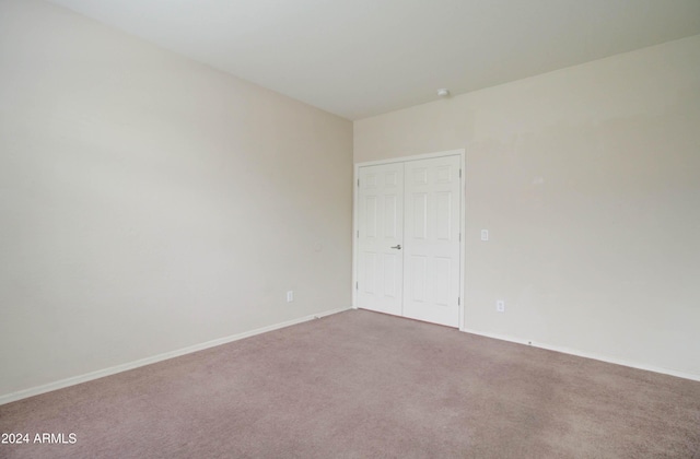 5659 S 239th Dr, Buckeye, AZ 85326 - unfurnished bedroom featuring a closet, baseboards, and carpet