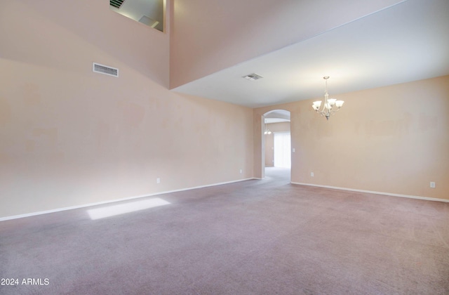 5659 S 239th Dr, Buckeye, AZ 85326 - unfurnished room with carpet, arched walkways, a notable chandelier, and baseboards