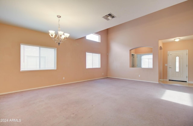 5659 S 239th Dr, Buckeye, AZ 85326 - carpeted spare room with visible vents, baseboards, and a notable chandelier