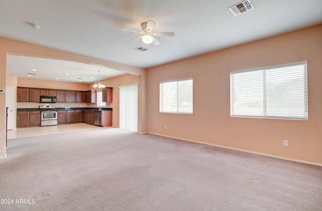 5659 S 239th Dr, Buckeye, AZ 85326 - unfurnished living room with light carpet, baseboards, and visible vents