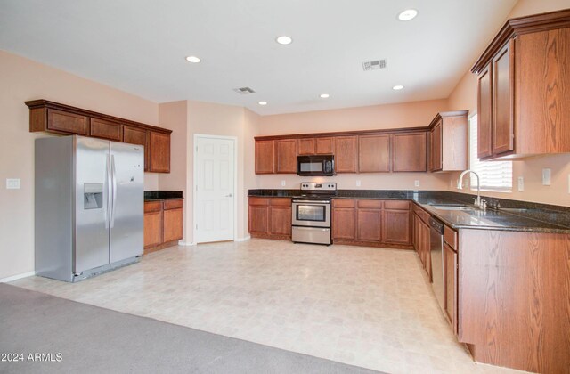 5659 S 239th Dr, Buckeye, AZ 85326 - kitchen with recessed lighting, visible vents, a sink, and appliances with stainless steel finishes