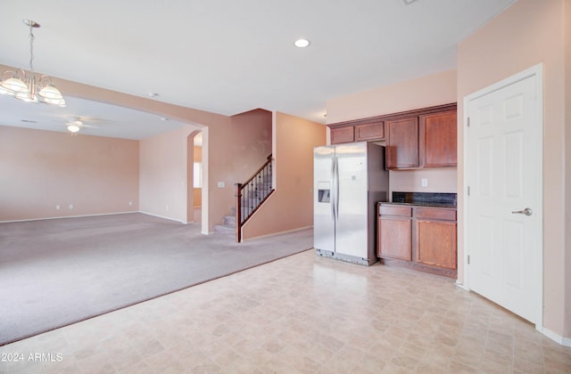 5659 S 239th Dr, Buckeye, AZ 85326 - kitchen featuring pendant lighting, stainless steel fridge with ice dispenser, ceiling fan, recessed lighting, and baseboards