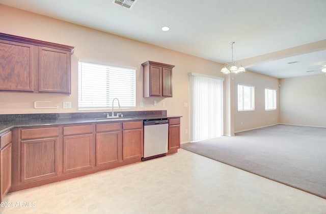 5659 S 239th Dr, Buckeye, AZ 85326 - kitchen featuring a chandelier, open floor plan, dark countertops, stainless steel dishwasher, and a sink
