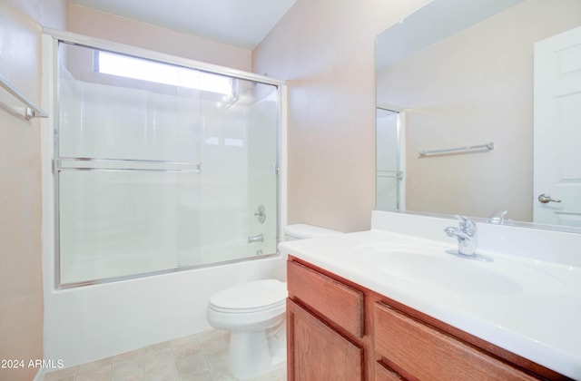 5659 S 239th Dr, Buckeye, AZ 85326 - full bathroom with bath / shower combo with glass door, vanity, toilet, and tile patterned flooring
