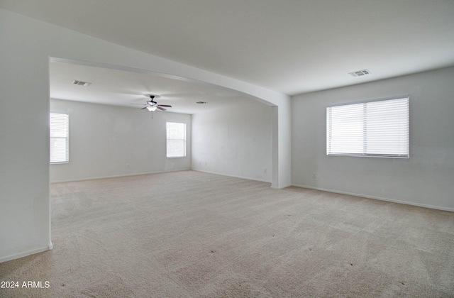 5659 S 239th Dr, Buckeye, AZ 85326 - spare room featuring visible vents, a ceiling fan, and carpet floors