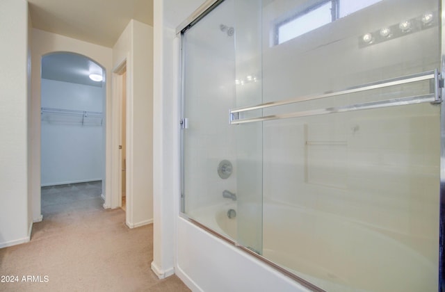 5659 S 239th Dr, Buckeye, AZ 85326 - bathroom with a spacious closet, combined bath / shower with glass door, and baseboards