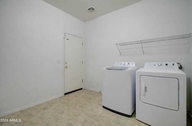 5659 S 239th Dr, Buckeye, AZ 85326 - washroom featuring baseboards, washing machine and dryer, laundry area, and visible vents