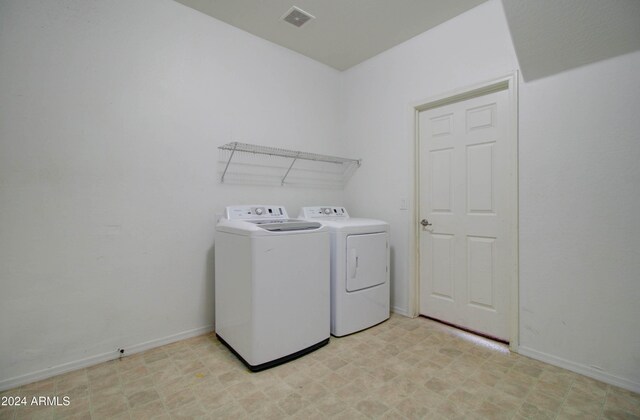 5659 S 239th Dr, Buckeye, AZ 85326 - clothes washing area with laundry area, light floors, visible vents, washer and dryer, and baseboards