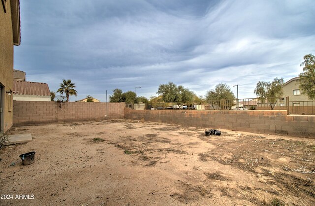 5659 S 239th Dr, Buckeye, AZ 85326 - view of yard with a fenced backyard