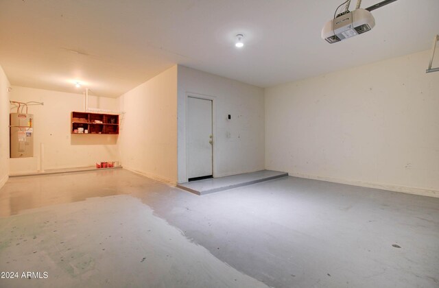 5659 S 239th Dr, Buckeye, AZ 85326 - garage featuring water heater and a garage door opener