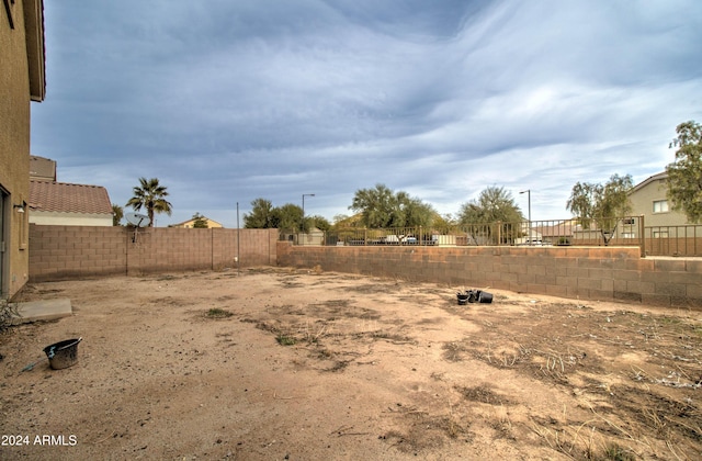 5659 S 239th Dr, Buckeye, AZ 85326 - view of yard featuring a fenced backyard