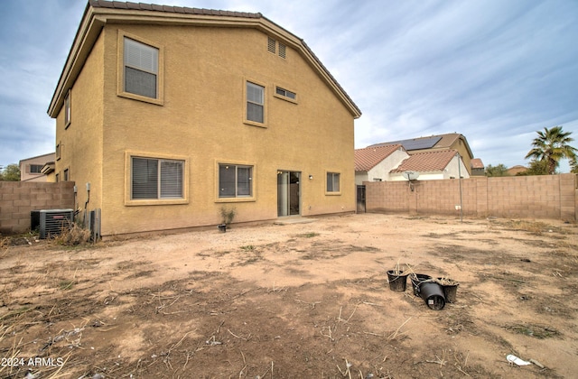 5659 S 239th Dr, Buckeye, AZ 85326 - back of property with a fenced backyard, cooling unit, and stucco siding