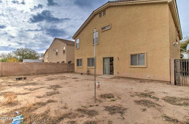 5659 S 239th Dr, Buckeye, AZ 85326 - back of property featuring stucco siding and fence private yard