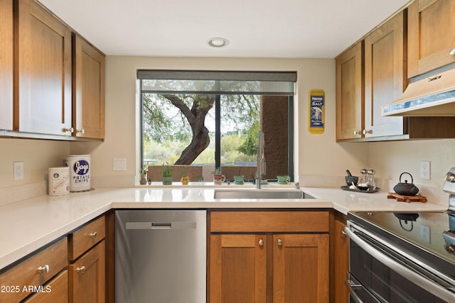 16233 E Rosetta Dr Unit 47, Fountain Hills, AZ 85268 - kitchen with appliances with stainless steel finishes, a sink, under cabinet range hood, light countertops, and brown cabinets