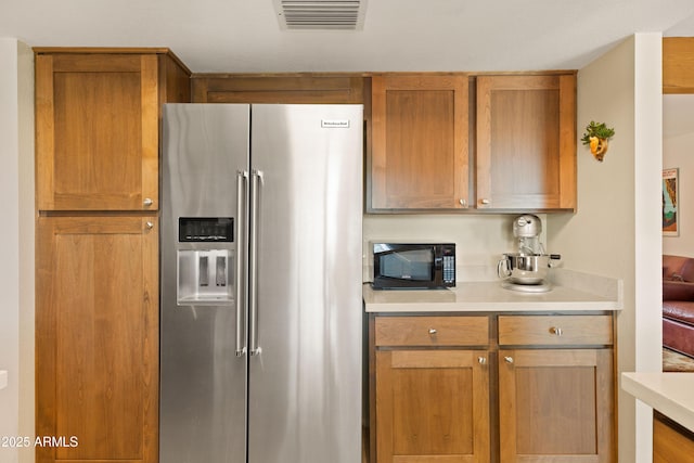 16233 E Rosetta Dr Unit 47, Fountain Hills, AZ 85268 - kitchen with high end refrigerator, black microwave, light countertops, and brown cabinetry