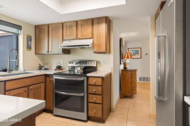 16233 E Rosetta Dr Unit 47, Fountain Hills, AZ 85268 - kitchen with exhaust hood, appliances with stainless steel finishes, a sink, and brown cabinetry