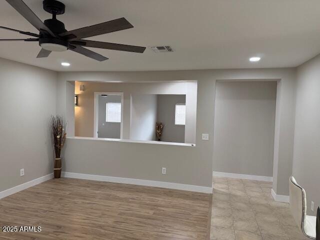 unfurnished room featuring recessed lighting, baseboards, ceiling fan, visible vents, and light wood-style floors