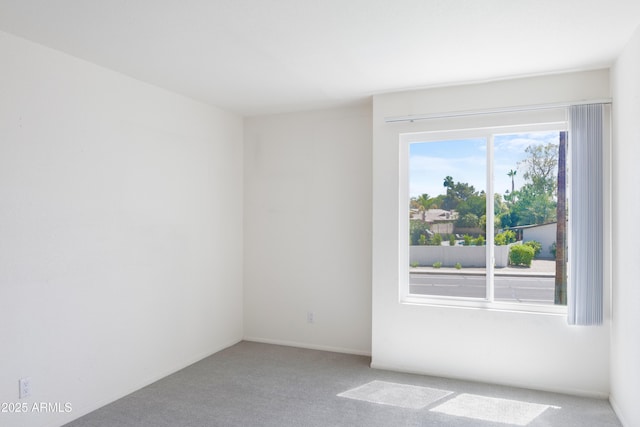 7350 N Via Paseo Del Sur Unit N207, Scottsdale, AZ 85258 - spare room featuring light colored carpet
