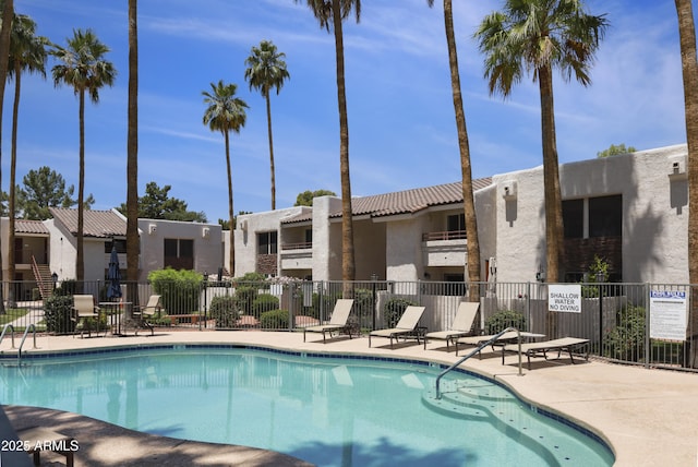 7350 N Via Paseo Del Sur Unit N207, Scottsdale, AZ 85258 - community pool featuring a patio and a residential view