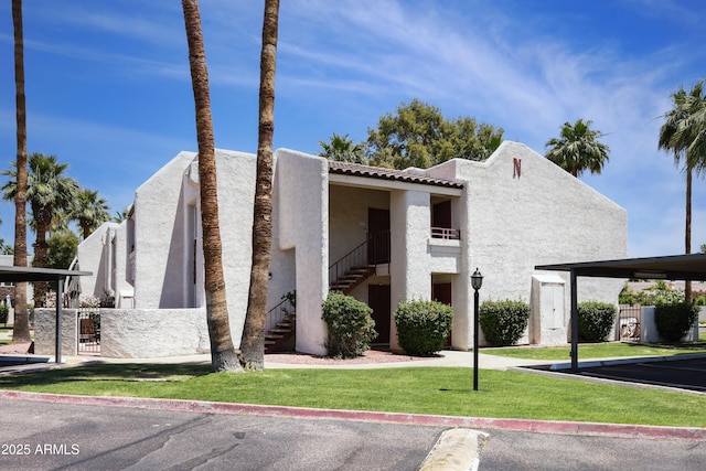 7350 N Via Paseo Del Sur Unit N207, Scottsdale, AZ 85258 - view of building exterior featuring stairs