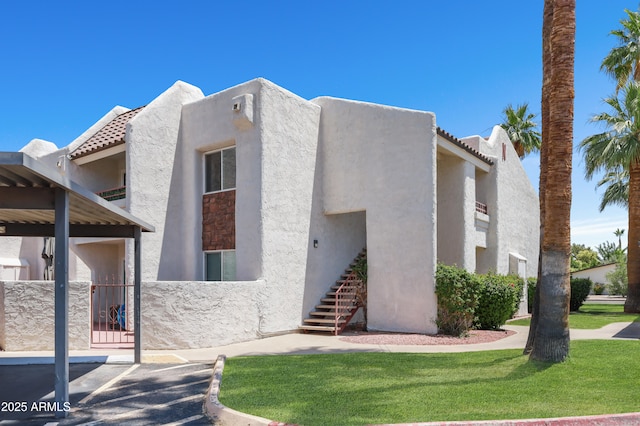 7350 N Via Paseo Del Sur Unit N207, Scottsdale, AZ 85258 - view of building exterior featuring stairway