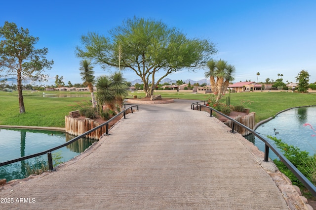 7350 N Via Paseo Del Sur Unit N207, Scottsdale, AZ 85258 - view of property's community with a lawn and a water view