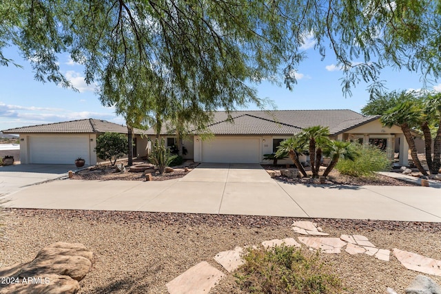 single story home featuring a garage