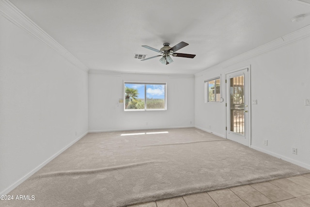 carpeted empty room with ceiling fan and ornamental molding