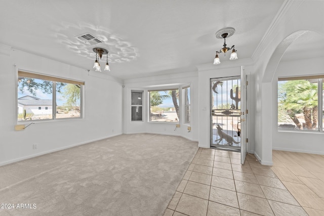 interior space with an inviting chandelier and crown molding