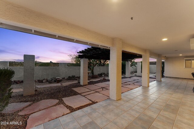 view of patio terrace at dusk