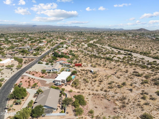 birds eye view of property featuring a mountain view