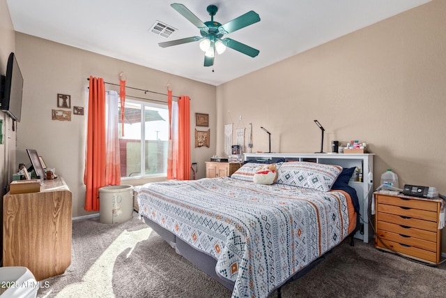 bedroom featuring ceiling fan and carpet