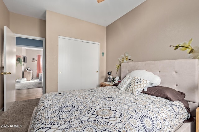 bedroom with carpet floors and a closet