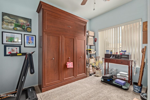 miscellaneous room featuring ceiling fan and carpet floors