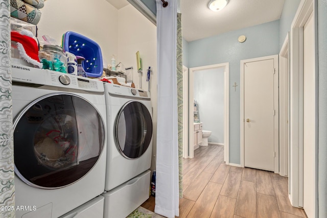 laundry area with washing machine and clothes dryer