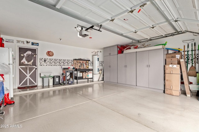 garage featuring white refrigerator, a garage door opener, and electric water heater