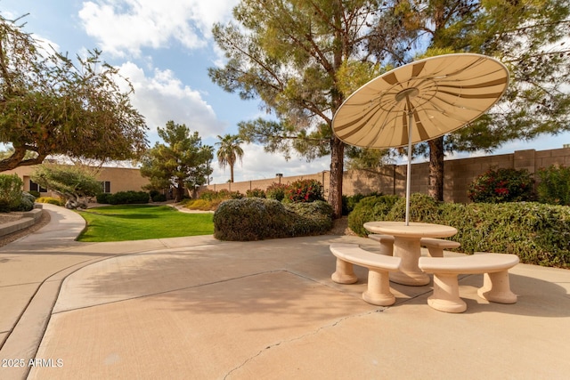 surrounding community featuring a patio and a lawn