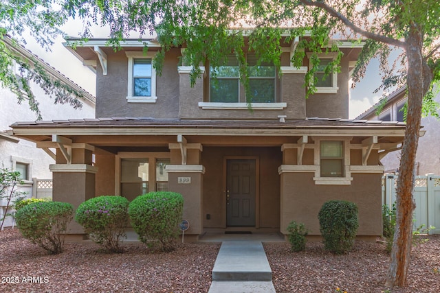 999 S Sabino Dr, Gilbert, AZ 85296 - view of front of property with stucco siding, a porch, and fence