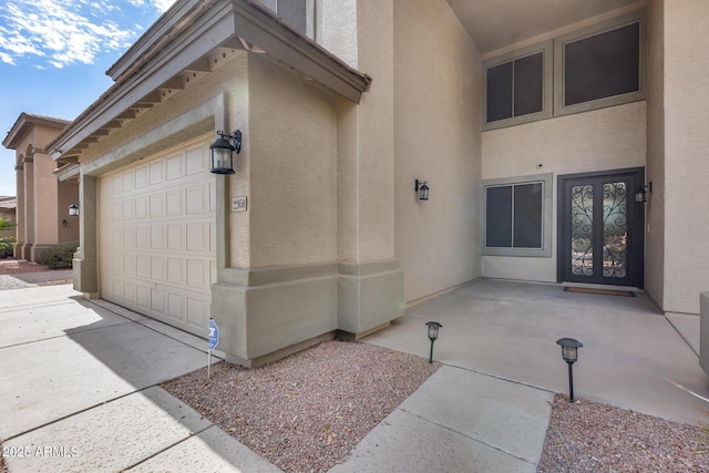 view of exterior entry featuring a garage