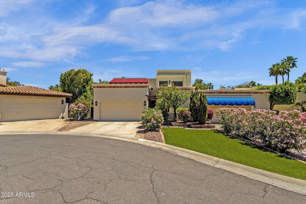 9241 S 50th St, Phoenix, AZ 85044 - view of front of house with stucco siding, concrete driveway, a front lawn, and a garage