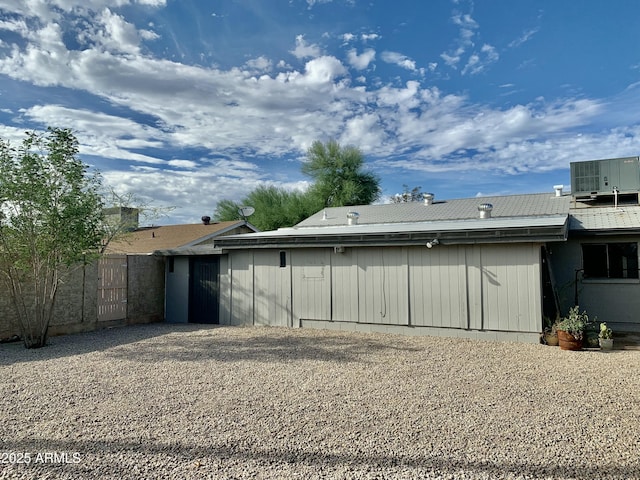 garage featuring central AC and fence