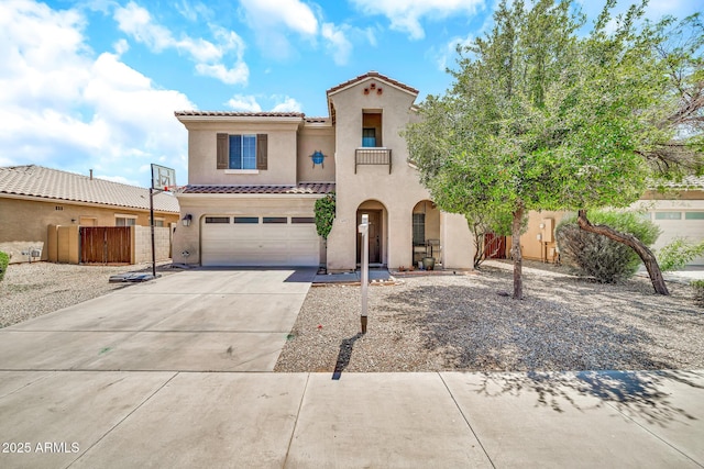 16917 W Sonora St, Goodyear, AZ 85338 - mediterranean / spanish-style house with stucco siding, an attached garage, concrete driveway, and a tile roof