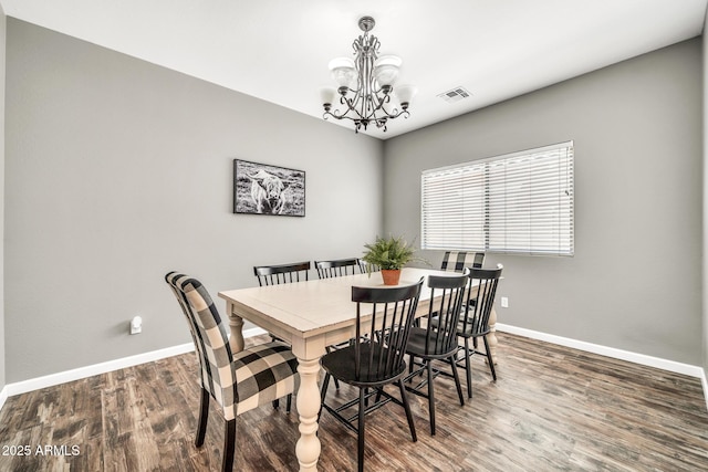 16917 W Sonora St, Goodyear, AZ 85338 - dining space featuring a chandelier and wood finished floors