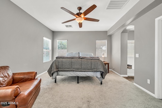 16917 W Sonora St, Goodyear, AZ 85338 - bedroom featuring arched walkways, carpet floors, and a ceiling fan